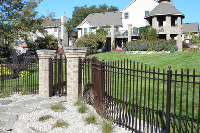 Curved wrought iron fence with gates
