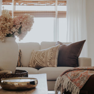 Soft pastels, brown accents and neutral colors with white pinch pleat curtains
