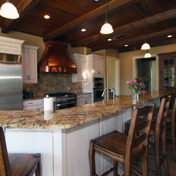 Copper Hood and Exposed Brick Give Rustic Feel to this Traditional Design