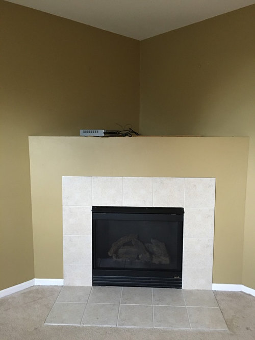 Designers nightmare dreaded corner fireplace. Yuck. No idea what to