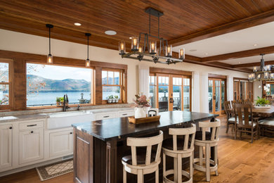 This is an example of an expansive rustic kitchen in Other.