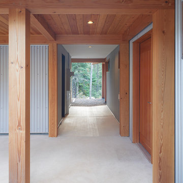 The breezeway is perpendicular to the colonnade with gear room on the left.