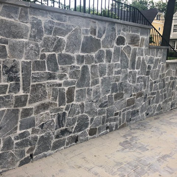 Stone Veneered Retaining Wall with Thermal Flagstone Caps in Chevy Chase, MD