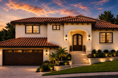 Tuscan beige two-story stucco house exterior photo in Los Angeles with a hip roof, a tile roof and a red roof