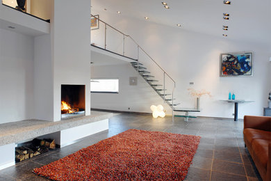 Family room - modern family room idea in Amsterdam