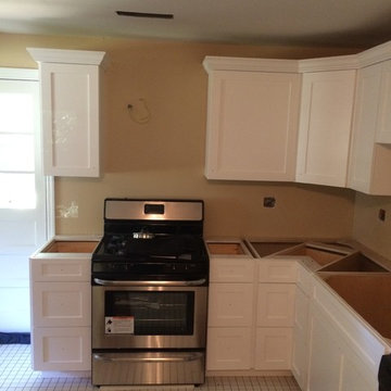 White Shaker Style Kitchen with Detailed Crown Molding