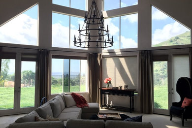 Inspiration for a large transitional formal and open concept carpeted living room remodel in Los Angeles with beige walls, no fireplace and no tv