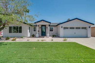 Example of a mid-sized farmhouse white one-story house exterior design in Phoenix