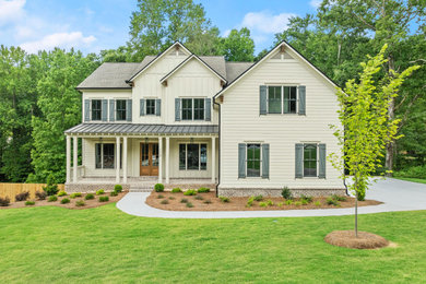 Example of a farmhouse exterior home design in Atlanta