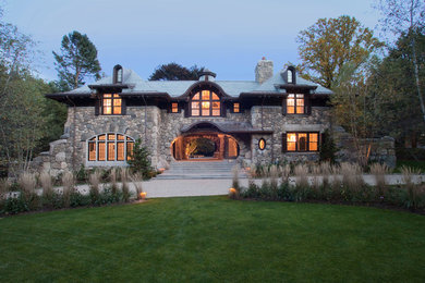 Inspiration for an expansive country three-storey exterior in Boston with stone veneer.