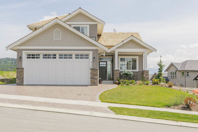 Example of a mid-sized trendy brown two-story concrete fiberboard gable roof design in Vancouver