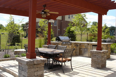 Inspiration for a large backyard patio remodel in Detroit
