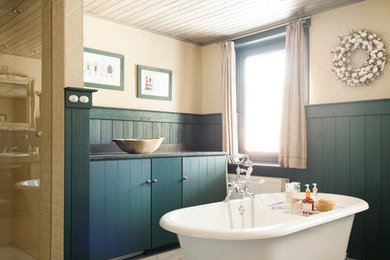 Cottage chic claw-foot bathtub photo in Other
