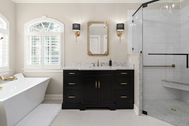 Large transitional master white tile and porcelain tile porcelain tile and white floor bathroom photo in Other with beaded inset cabinets, black cabinets, a two-piece toilet, gray walls, an undermount sink, quartz countertops and a hinged shower door