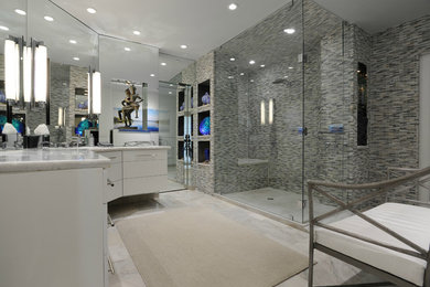 Double shower - huge traditional master beige tile and porcelain tile porcelain tile double shower idea in Miami with furniture-like cabinets, white cabinets, blue walls, an undermount sink, marble countertops and a hinged shower door
