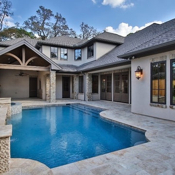 Combining Stucco and Stone bring charm to this Country French