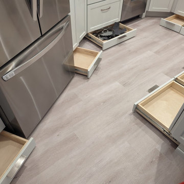 Small kitchen with storage options in toe kick