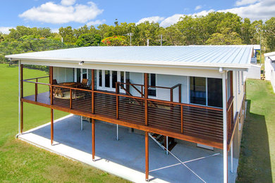 Tropical deck with a roof extension.