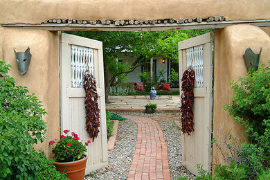 Inspiration for a large rustic full sun front yard formal garden in Albuquerque for summer.