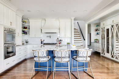 Kitchen - traditional kitchen idea in Louisville with glass-front cabinets, white cabinets, granite countertops, white backsplash, stainless steel appliances and gray countertops
