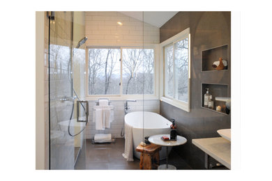 Mid-sized minimalist master gray tile and ceramic tile porcelain tile, gray floor, double-sink and vaulted ceiling bathroom photo in Cincinnati with flat-panel cabinets, medium tone wood cabinets, a two-piece toilet, white walls, a vessel sink, quartz countertops, gray countertops and a built-in vanity