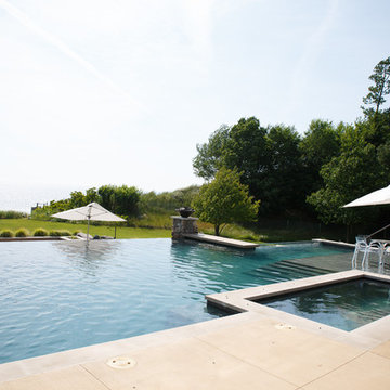 Modern pool, spa and landscape on lakeshore