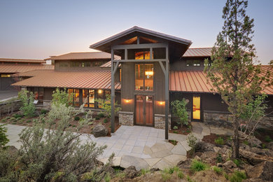 Example of a farmhouse two-story exterior home design in Other