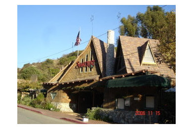 Example of an exterior home design in Orange County with a shingle roof
