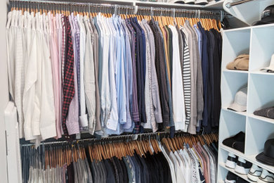 Walk-in closet - mid-sized modern men's walk-in closet idea in Orange County