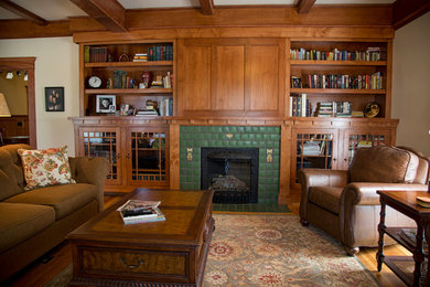 Living room - craftsman enclosed light wood floor living room idea in Boise with white walls, a standard fireplace, a tile fireplace and a concealed tv