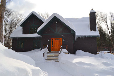 Example of a mid-sized mountain style brown two-story wood exterior home design in Boston
