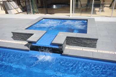 Small modern pool in Perth with a hot tub.