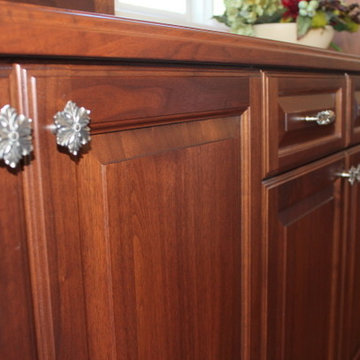 Beautiful Kitchen Featuring the Opulent Scroll Pulls & Opulent Flower Wood Knobs