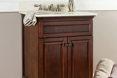Example of a bathroom design in Boston with raised-panel cabinets and medium tone wood cabinets