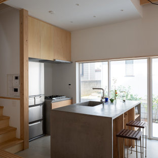 Design ideas for a small galley eat-in kitchen in Other with an integrated sink, open cabinets, light wood cabinets, brown splashback, timber splashback, stainless steel appliances, concrete floors, a peninsula, grey floor, grey benchtop and timber.