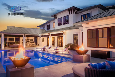Large minimalist backyard tile and rectangular lap pool house photo in Jacksonville