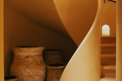 Inspiration for a mediterranean curved staircase remodel in San Francisco