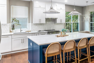 Kitchen - mid-sized transitional kitchen idea in Charlotte with shaker cabinets and an island