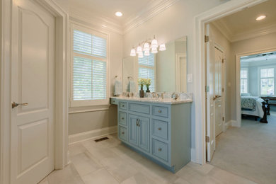 Inspiration for a mid-sized transitional master white tile porcelain tile, gray floor, single-sink and wall paneling bathroom remodel in Other with beaded inset cabinets, blue cabinets, a one-piece toilet, white walls, an undermount sink, quartz countertops, a hinged shower door, white countertops and a built-in vanity