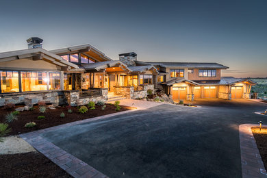 Large mountain style brown split-level wood gable roof photo in Other