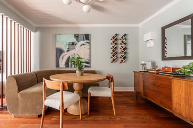 Transitional medium tone wood floor dining room photo in Philadelphia with blue walls
