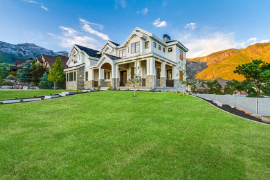 Large country white two-story concrete fiberboard exterior home idea in Salt Lake City