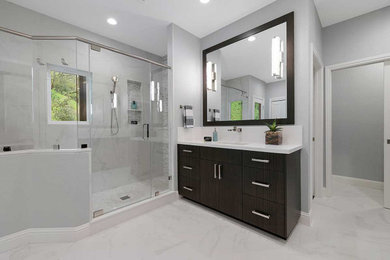 Bathroom - large transitional master white tile and porcelain tile porcelain tile, white floor and double-sink bathroom idea in San Francisco with flat-panel cabinets, dark wood cabinets, a two-piece toilet, gray walls, quartz countertops, a hinged shower door, white countertops, a built-in vanity and an undermount sink