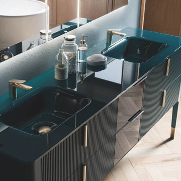Modern deep green vanity with green countertop and integrated sinks