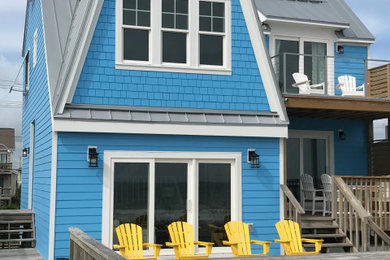 Example of a beach style home design design in Wilmington
