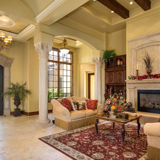 This is an example of an expansive mediterranean formal open plan living room in Sacramento with beige walls, marble flooring, a standard fireplace, a concrete fireplace surround and no tv.