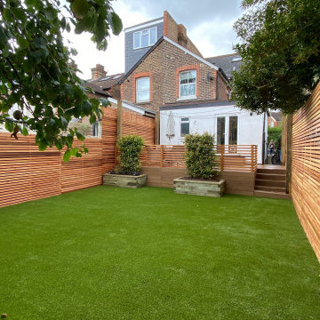 Millboard deck, artificial grass and cedar slat fencing in Reigate