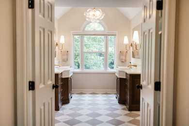 Inspiration for a large timeless master white tile and porcelain tile porcelain tile, beige floor, double-sink and vaulted ceiling bathroom remodel in Baltimore with beaded inset cabinets, brown cabinets, beige walls, an undermount sink, quartz countertops, a hinged shower door, white countertops and a freestanding vanity