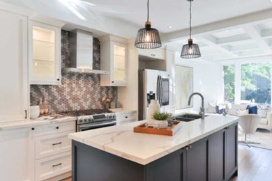 Example of a transitional kitchen design in Toronto