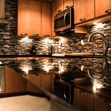Maple kitchen cabinets with black absolute granite countertops
